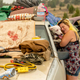 Evacuated Chester resident April Phillips hugs their family dog at an evacuation center for the Dixie fire in Susanville, California, on Aug. 6, 2021.
